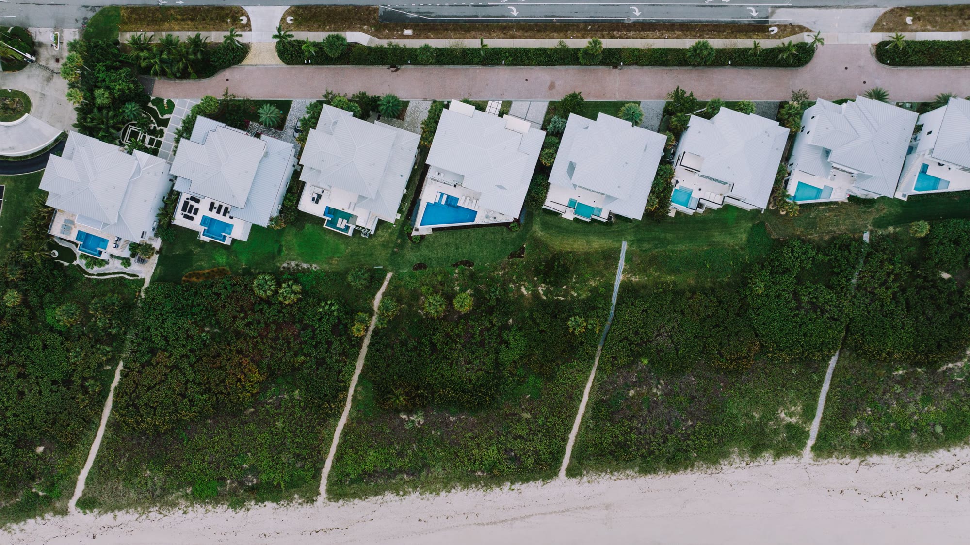 Aerial view of oceanfront homes, evocative of Indian River Shores' quiet gated coastline