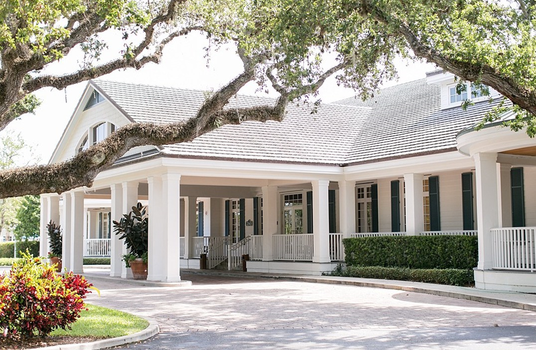 Golf green and clubhouse overlooking the water at Quail Valley Golf Club